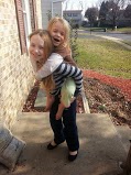 Piggy back ride. The youngest has in Vampire fangs in December....